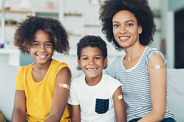 istock Smiling mother and two children just had their vaccinations 1357524916