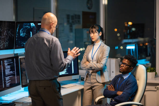 istock Mature manager giving instructions to intercultural subordinates 1357524969