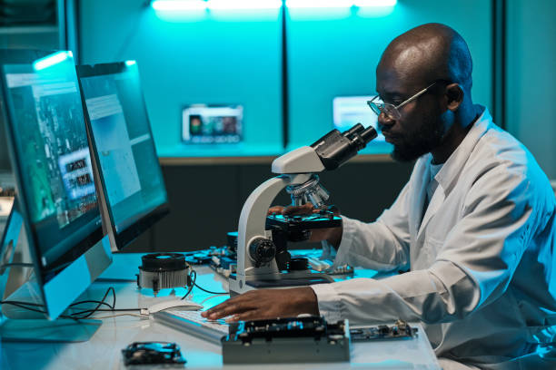 istock Young African researcher pressing key of computer keypad 1357525281
