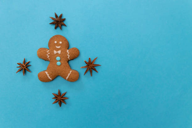 istock Gingerbread cookie boy on a blue background. Christmas cookie 1357525618