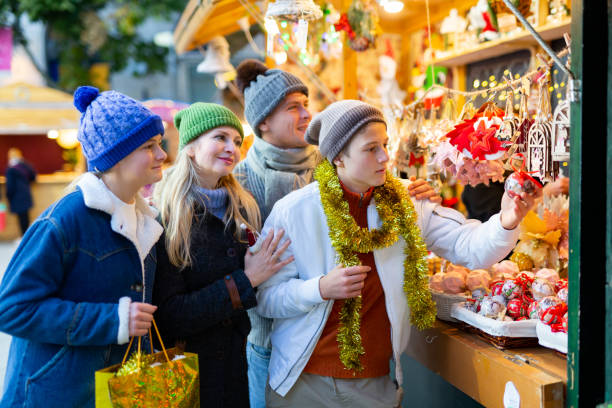 istock Happy family purchasing christmas decorations 1357525649