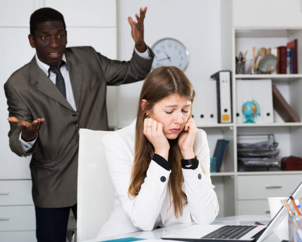 istock Upset woman with angry boss 1357525858
