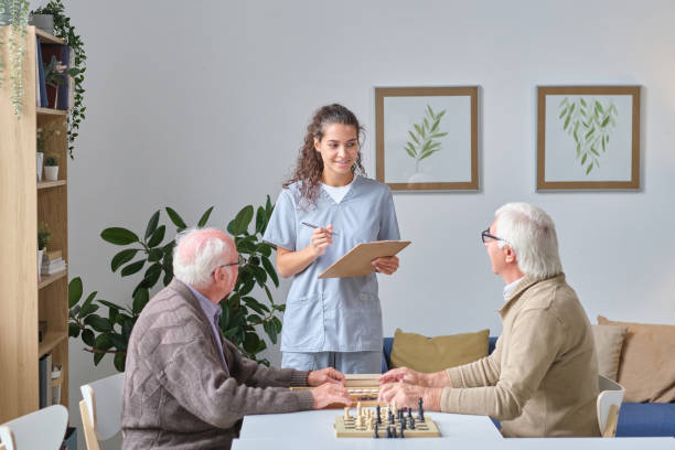 istock Nurse talking to senior men in nursing home 1357525992