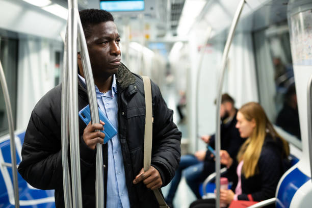 istock African man in metro train 1357526197