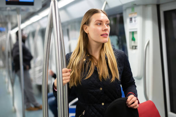 istock Young woman in subway car 1357526240