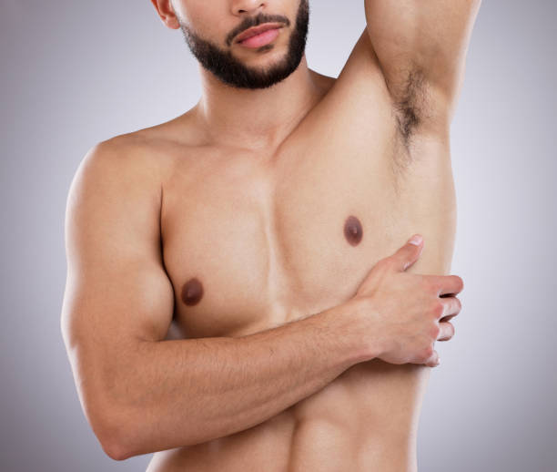 istock Shot of a man showing his under arms against a studio background 1357526899