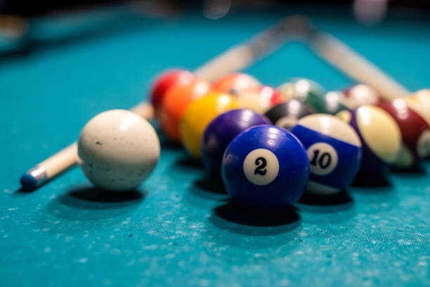 istock Billiard balls in a green pool table, ready for recreational activity 1357527674