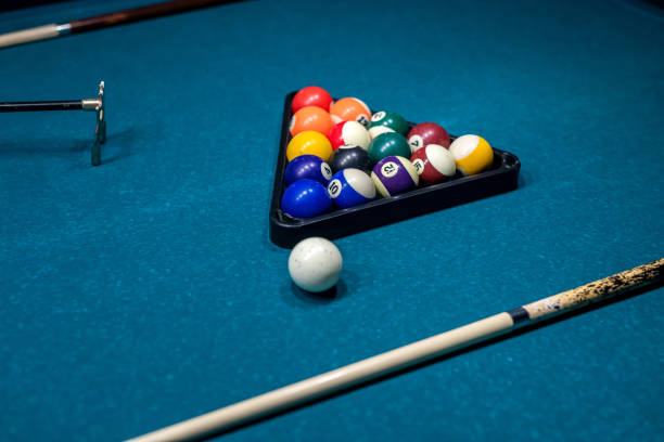 istock Billiard cue and colour balls on snooker table while game 1357527720
