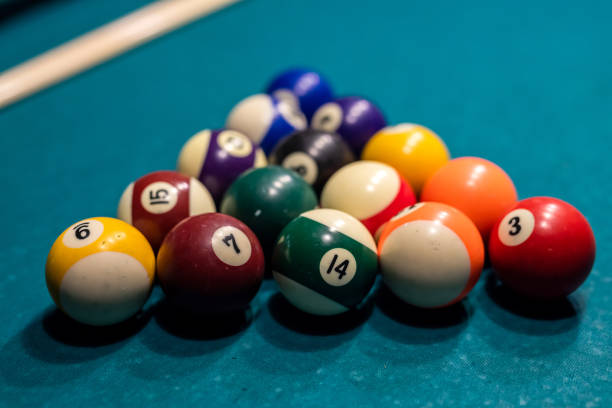 istock Billiard balls in a green pool table, ready for recreational activity 1357527959