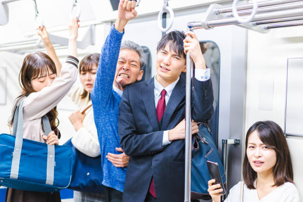 istock Business people commuting on crowded trains 1357528397