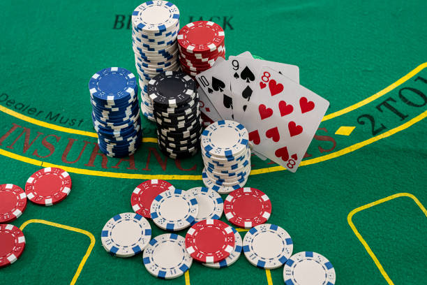istock colored brand new chips columns stand with fan cards on a poker table 1357528655