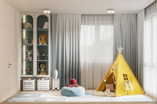 3d render of a toy teepee tent in children's room. Digitally generated image of teepee tent in kids room with toys inside a glass cabinet.