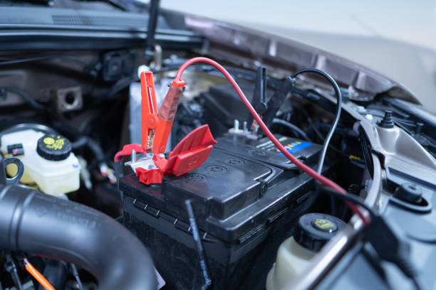 istock charging a dead car battery in winter, selective focus 1357530065