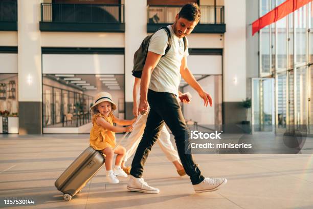 Young Family Having Fun Traveling Together Stock Photo - Download Image Now - Travel, Suitcase, Airport