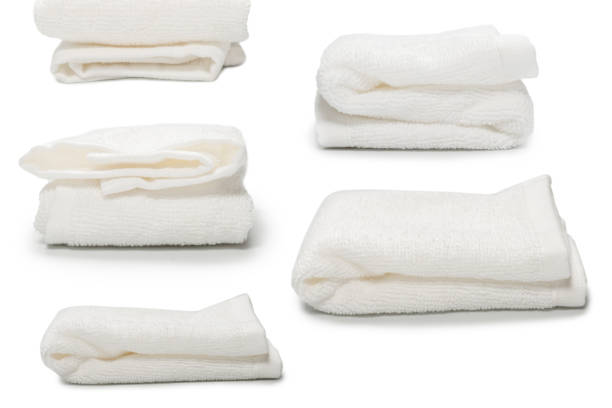 istock White fluffy cotton towel isolated on a white background. 1357530503