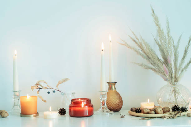 istock autumn home decorations with burning candles 1357531262