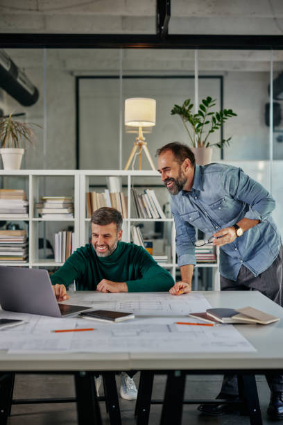 istock Business people discussing over new business project in office 1357532123