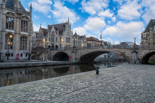 Graslei with the towers of Ghent At the Graslei with the towers of Ghent with beautiful refection st nicholas church prague stock pictures, royalty-free photos & images