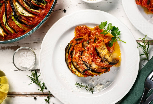 Tradininal french vegetable dish ratatouille French tradininal vegetable dish ratatouille in white plate. Close up and top view ratatouille stock pictures, royalty-free photos & images