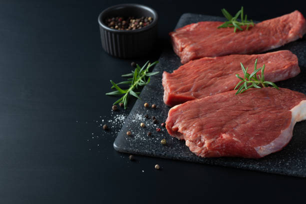 istock Fresh raw beef steak sirloin with rosemary. 1357535164