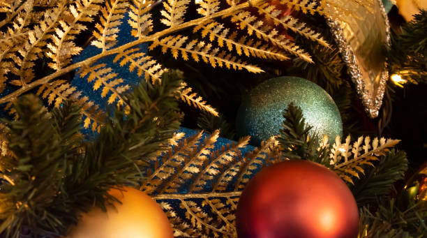 istock Decorated Christmas tree on blurred, sparkling and fairy background 1357535349