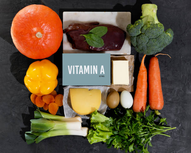 A set of natural products rich in vitamin A retinol. Healthy food concept. Cardboard sign with the inscription. A set of natural products rich in vitamin A retinol. Healthy food concept. Cardboard sign with the inscription. Black background. carotene stock pictures, royalty-free photos & images
