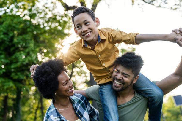 istock Young loving family having fun in the park 1357538896