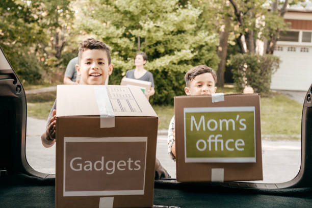 istock Family with cardboard boxes 1357539909
