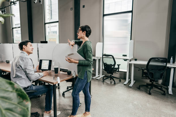 istock Executive Leadership Coaching and Team Development. Men and women discussion employment law 1357539960