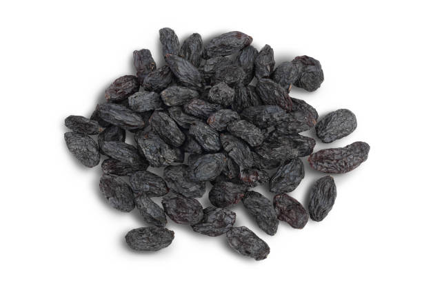 istock Black raisin isolated on white background with clipping path. Top view. Flat lay 1357540348