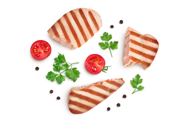 istock Tuna fish steak grilled isolated on white background with clipping path and full depth of field, Top view. Flat lay 1357540352
