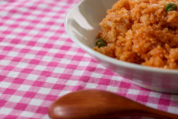 istock Chicken rice on the dish isolated on the gingham check tablecloth. 1357540796