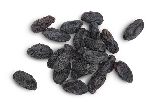 istock Black raisin isolated on white background with clipping path. Top view. Flat lay 1357541043