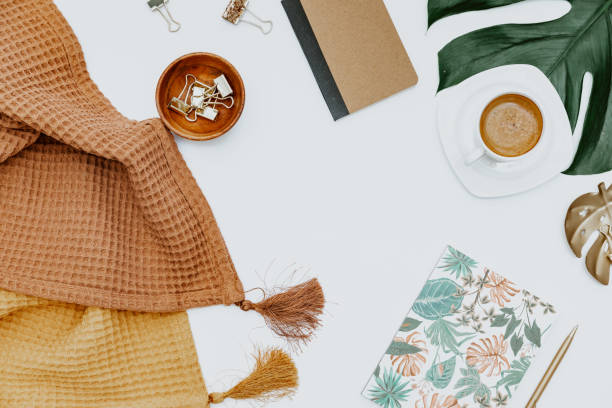 istock Flat lay Blogger workspace. Home office desk with tropical monstera leaf, cup of coffee, supplies,  notebook and pen. Flat lay, top view, copy space 1357542013