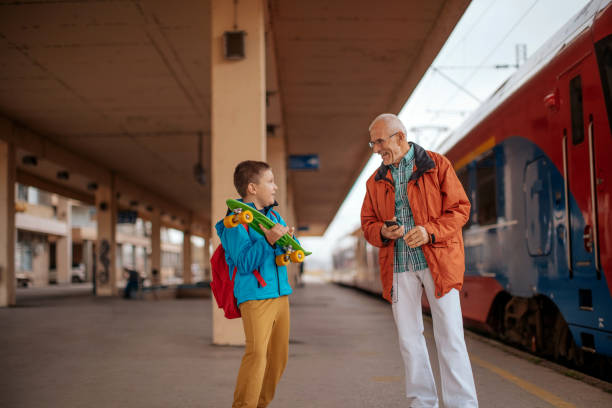 istock Waiting for train with grandson 1357546650