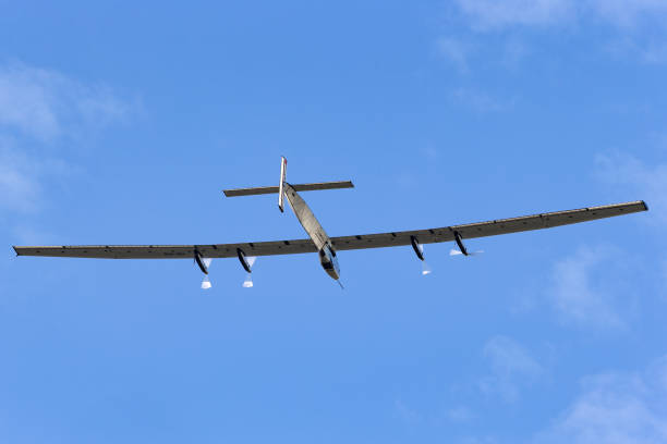Payerne, Switzerland - September 8, 2014: Solar Impulse 2 a Swiss developed long range experimental solar powered aircraft with the registration HB-SIB flying above Payerne Airport.