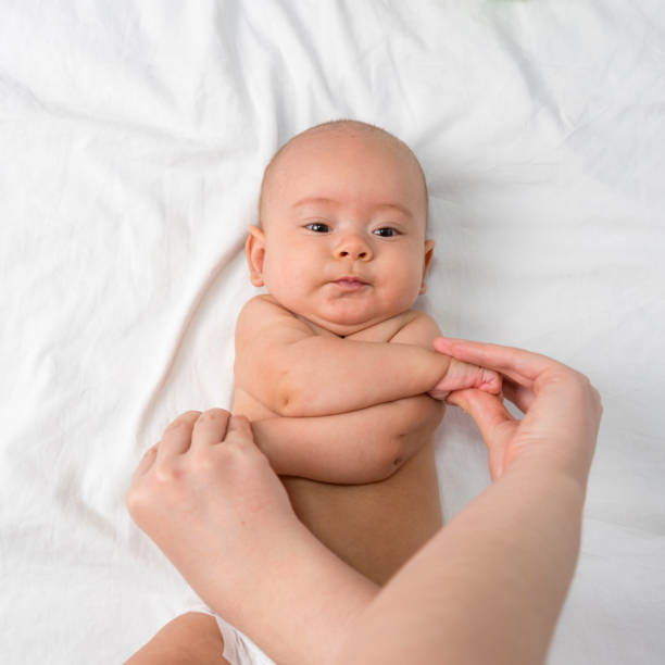 istock Doctor doing strengthening exercises for newborn 1357547869