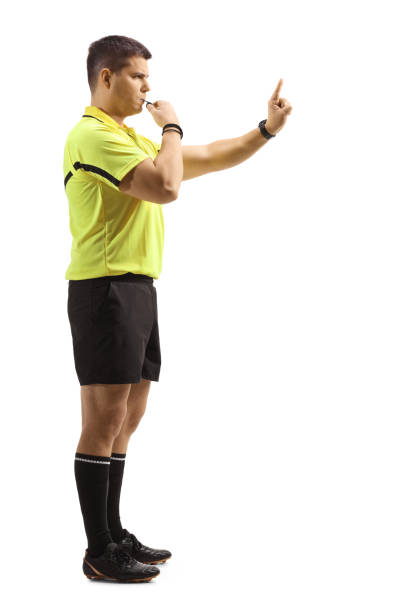 Full length profile shot of an angry sports referee blowing a whistle Full length profile shot of an angry sports referee blowing a whistle isolated on white background offside stock pictures, royalty-free photos & images