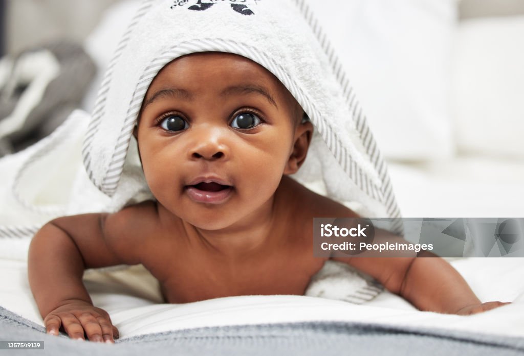 Shot of an adorable baby boy wearing a hoody towel I'm ready for my rub Baby - Human Age Stock Photo