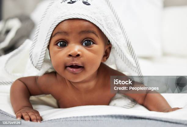 Shot Of An Adorable Baby Boy Wearing A Hoody Towel Stock Photo - Download Image Now - Baby - Human Age, Newborn, African Ethnicity