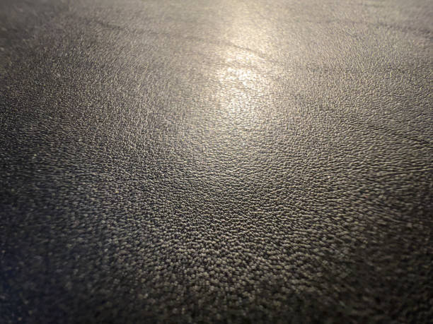 istock A macro image of fine black leather in the light. 1357549402