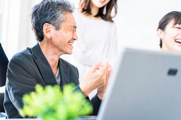 istock Business persons having a discussion with a smile 1357549554