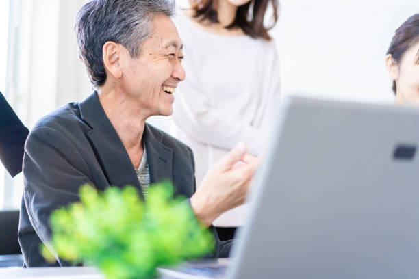 istock Business persons having a discussion with a smile 1357549560
