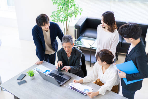 istock Business persons having a discussion with a smile 1357549567