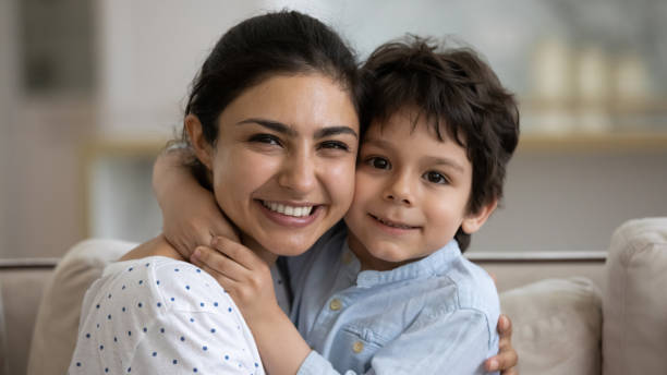istock Happy Indian mom hugging little smiling son with cheek touch 1357550414