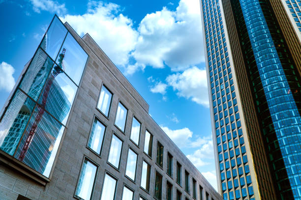 istock Skyscraper with crane in the mirroring 1357551195