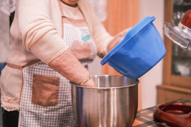 istock Adding more ingredients to the recipe 1357551338