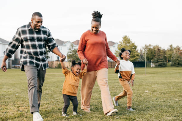 istock Family enjoying springtime outdoors with kids 1357554900