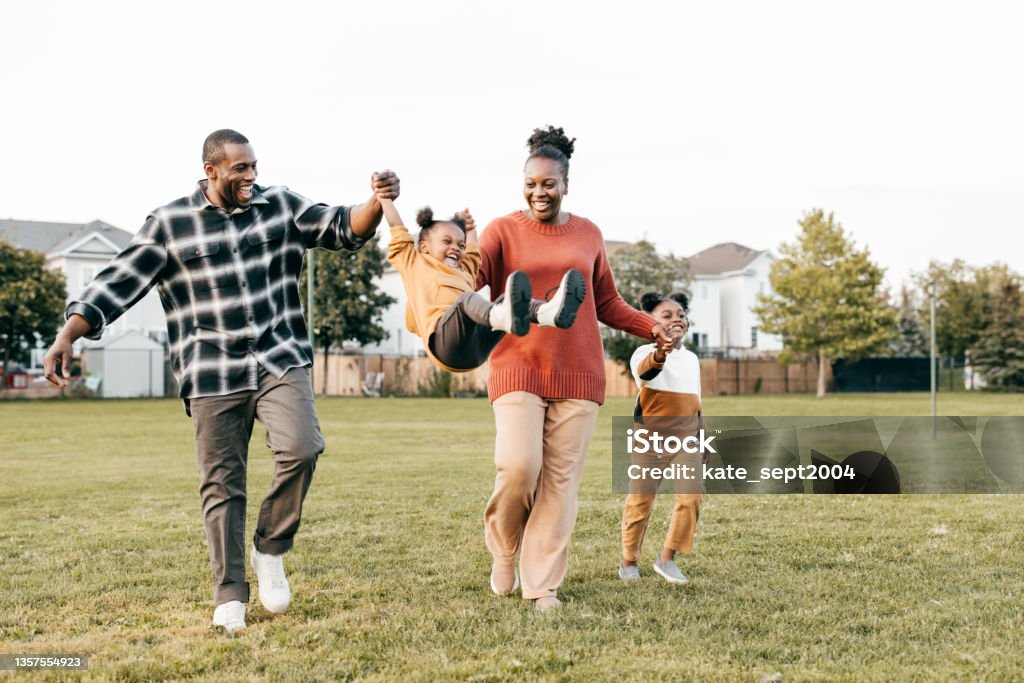 Family enjoying springtime outdoors with kids Family first : parents enjoying springtime outdoors with kids Family Stock Photo