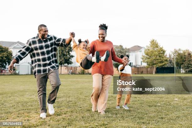 Family Enjoying Springtime Outdoors With Kids Stock Photo - Download Image Now - Family, Happiness, Healthy Lifestyle